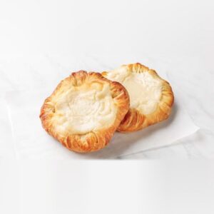 Two baked cheese Danish crowns with a creamy cheese center