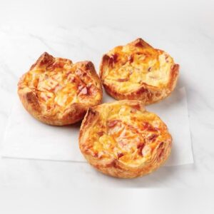 Three baked ham and cheese breakfast souffles