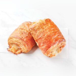 Two baked turkey and cheese croissants