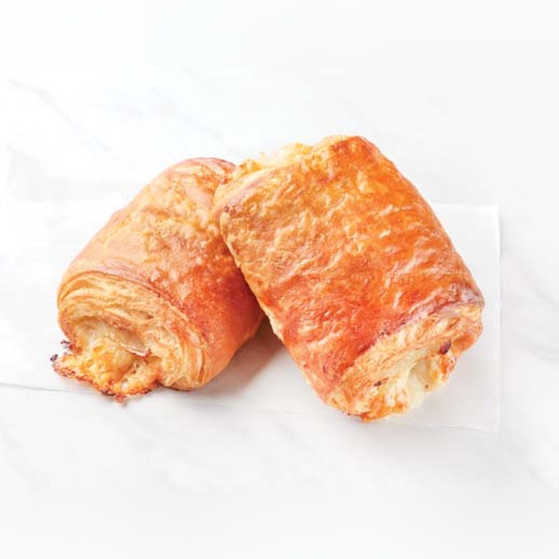 Two baked turkey and cheese croissants