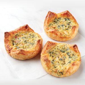 Three baked spinach and cheese breakfast souffles